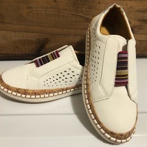 Brandlless faux leather tennis shoes. Serape elastic and cork details
